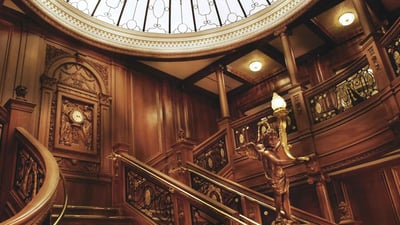 A sweeping view of the Grand Staircase at the Titanic Museum, built to original blueprints. 