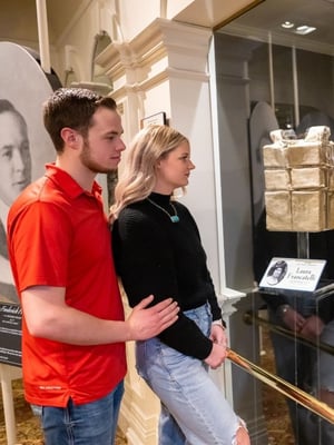 couple at the new lifejacket display in Branson, MO at the Titanic Museum Attraction
