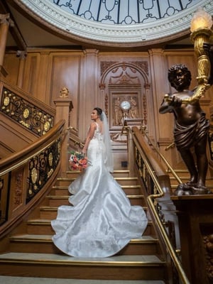 A bride standing on the Grand Staircase.