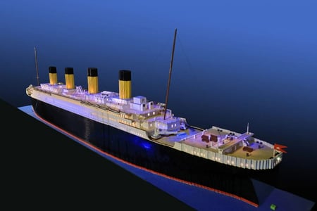 Large LEGO model of the RMS Titanic built from 56,000 bricks, with a starry sky and iceberg backdrop
