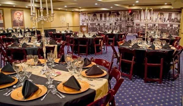Dining room with event tables ready for an exclusive group dinner at the Titanic Museum Attraction.