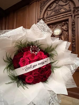 Image of a rose with banner saying 
