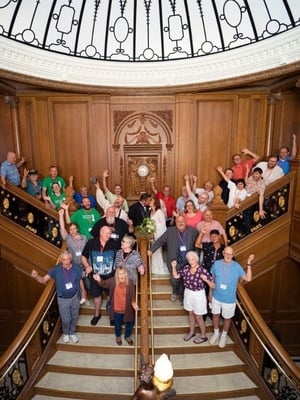 A wedding party photo on the grand staircase of the Titanic Museum Attraction.