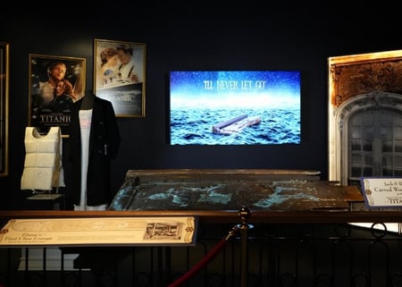 Titanic Movie Gallery exhibit featuring the wooden Jack and Rose panel. Displayed on screen above the exhibit are the words 