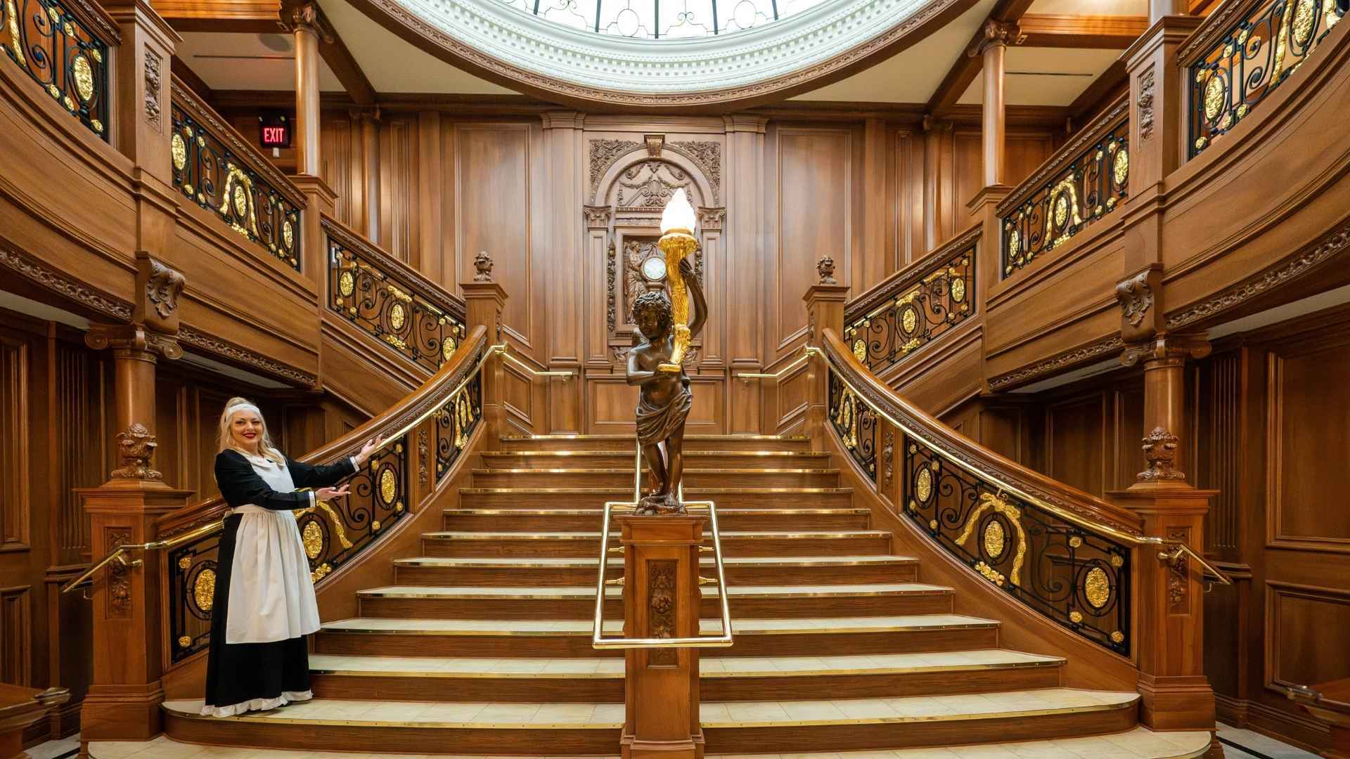Grand Staircase entrance: A maid greets visitors and encourages them to explore.